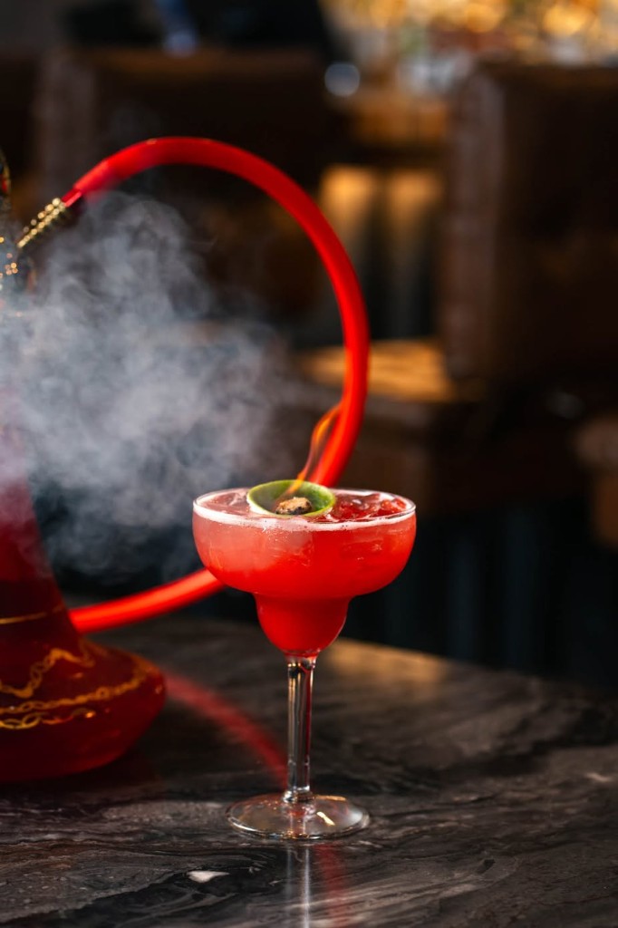 Signature cocktail and premium hookah at Twisted Bar and Grill