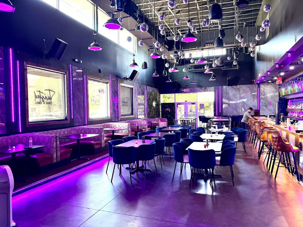 Twisted Bar and Grill dining area with booths and bar seating